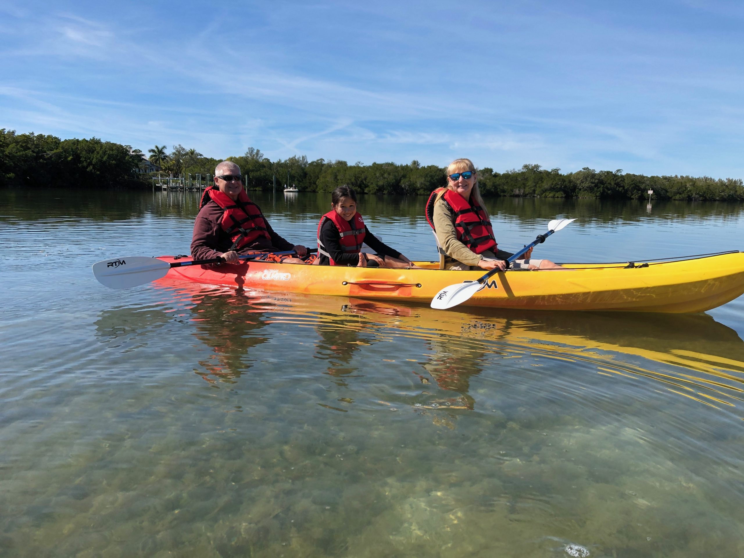 Family in a Tandem Kayak Rental showing room for child in the middle