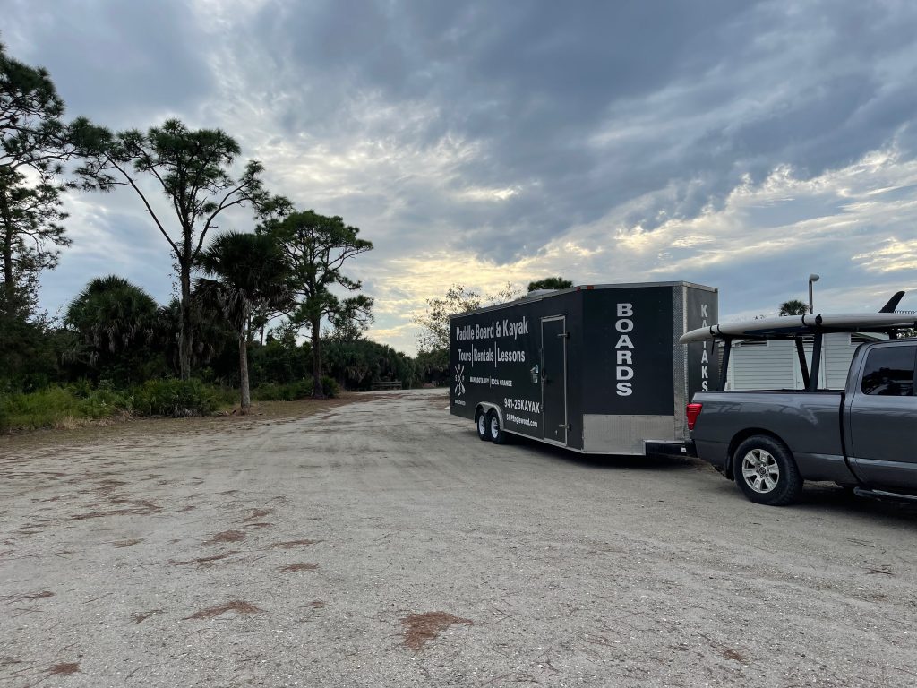 company truck and trailer at sunset